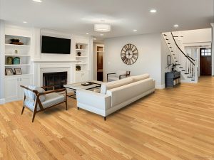 Living room featuring natural oak Wickham hardwood flooring with modern white furnishings