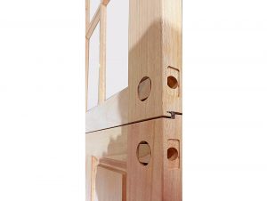 Close-up of the meeting rails on an unfinished mahogany Dutch door, detailing the hardware bore holes on both the top and bottom sections.