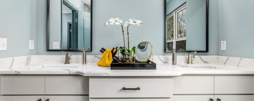 light gray bathroom vanity with white marble top
