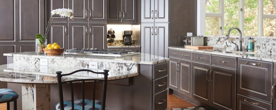 Kitchen with gray floor-to-ceiling cabinets, demonstrating kitchen cabinet replacement cost from Builders Surplus