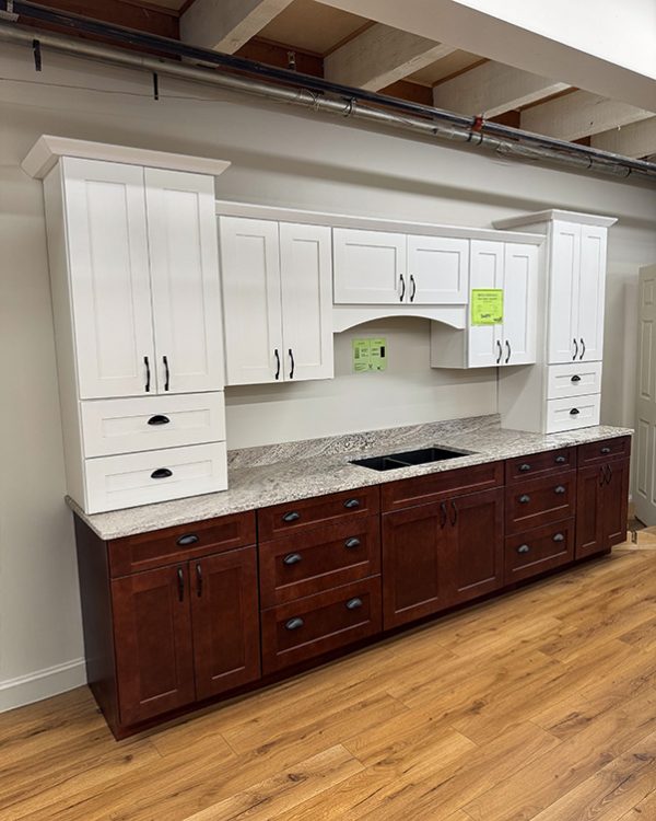 Marsh Summerfield kitchen cabinet display with Nevasca Mist granite countertop and black granite composite sink