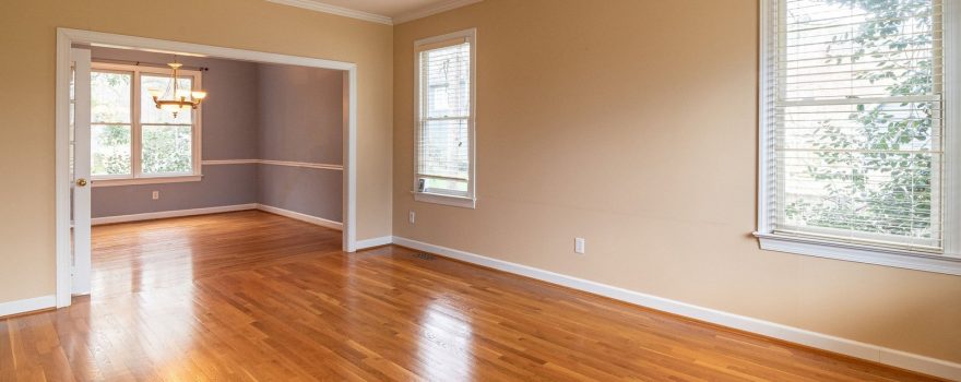 Bright empty room with gleaming oak hardwood floors.